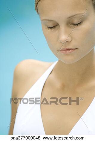 Woman in bathing suit with eyes closed View Large Photo Image Stock Photo - Woman in bathing suit with eyes closed. Fotosearch