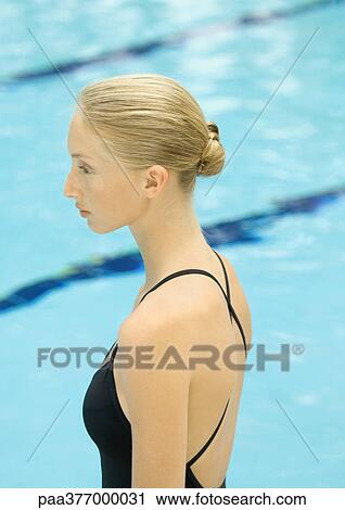 Woman in front of pool, side view View Large Photo Image Stock Image - Woman in front of pool, side view. Fotosearch