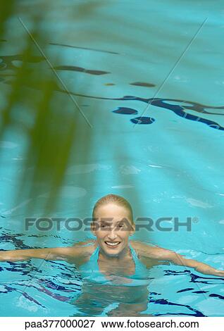 Woman in pool, smiling at camera View Large Photo Image Stock Photo - Woman in pool, smiling at camera. Fotosearch