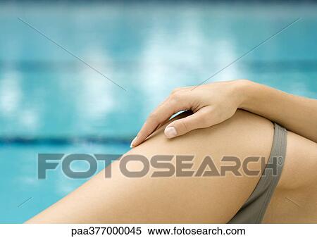 Woman lounging by side of pool, close-up of hip View Large Photo Image Stock Photography - Woman lounging by side of pool, close-up of hip. Fotosearch