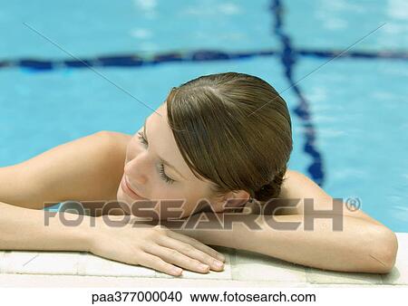Woman resting head on side of pool View Large Photo Image Stock Image - Woman resting head on side of pool. Fotosearch