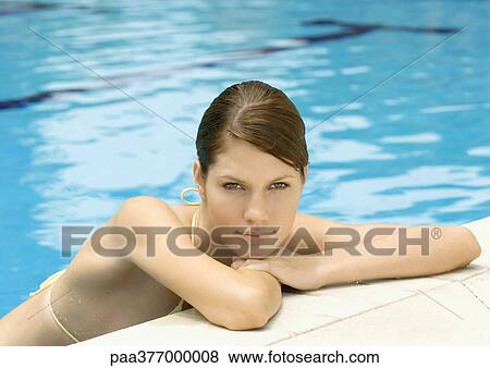 Woman resting head on side of pool View Large Photo Image Stock Photo - Woman resting head on side of pool. Fotosearch