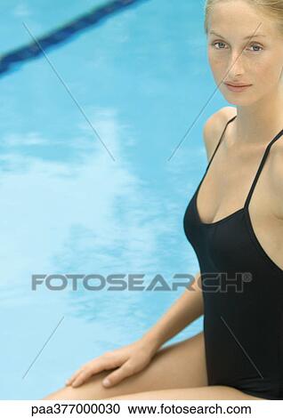 Woman sitting near pool View Large Photo Image Stock Image - Woman sitting near pool. Fotosearch