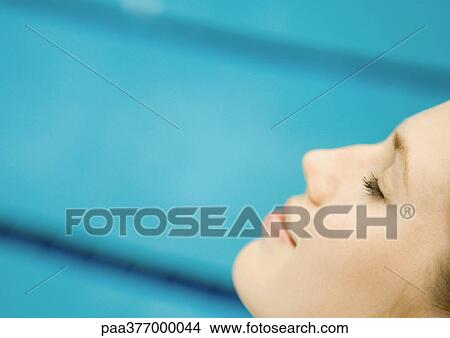 Woman smiling with eyes closed View Large Photo Image Picture - Woman smiling with eyes closed. Fotosearch