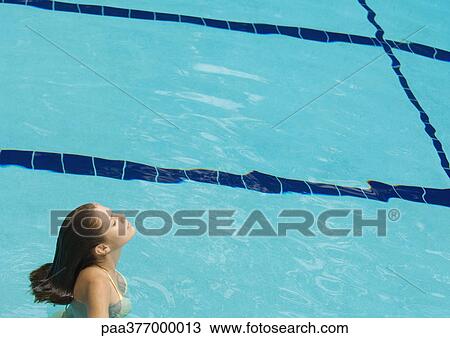 Woman standing in pool with head back and eyes closed View Large Photo Image Stock Image - Woman standing in pool with head back and eyes closed. Fotosearch