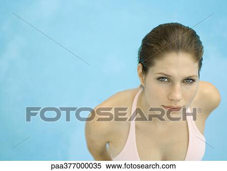 Woman wearing bikini, water in background, high angle view View Large Photo Image Stock Photography - Woman wearing bikini, water in background, high angle view. Fotosearch