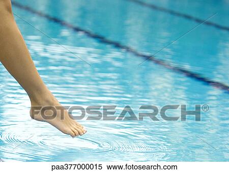 Woman's leg testing water in pool View Large Photo Image Stock Photography - Woman's leg testing water in pool. Fotosearch