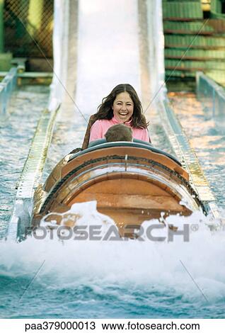 Girl riding log flume View Large Photo Image Stock Image - Girl riding log flume. Fotosearch