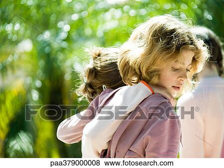 Girls with arms around each others' shoulders View Large Photo Image Stock Photo - Girls with arms around each others' shoulders. Fotosearch