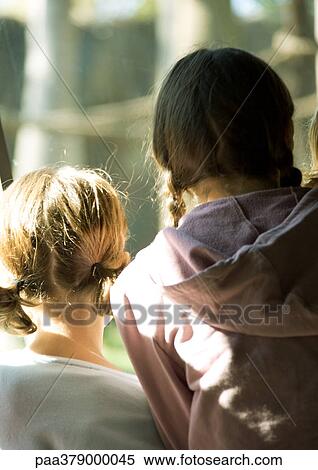Two girls, rear view View Large Photo Image Stock Photography - Two girls, rear view. Fotosearch