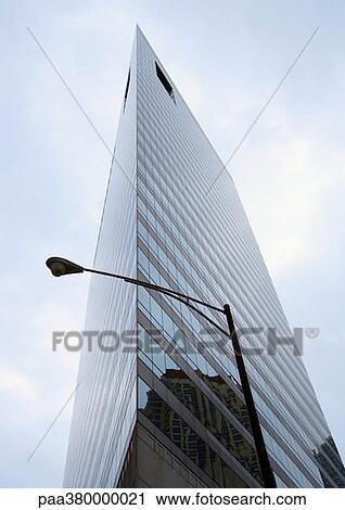 Skycraper and street lamp, low angle view View Large Photo Image Stock Image - Skycraper and street lamp, low angle view. Fotosearch