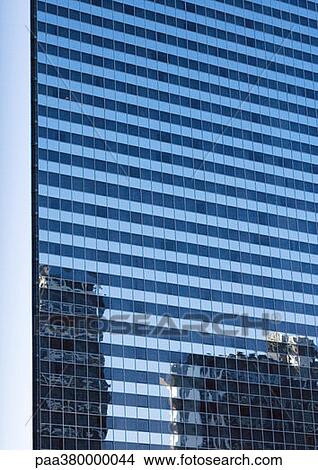 Skycraper, full frame close-up view with reflection of other buildings on facade View Large Photo Image Picture - Skycraper, full frame close-up view with reflection of other buildings on facade. Fotosearch
