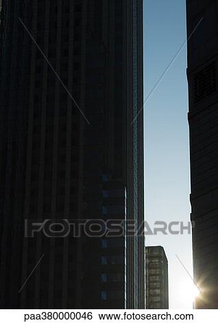 Skycrapers, backlit by sun View Large Photo Image Stock Photograph - Skycrapers, backlit by sun. Fotosearch