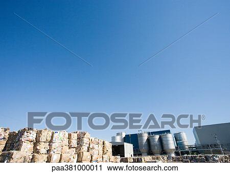 Stock Image - Bales of paper at paper mill. Fotosearch