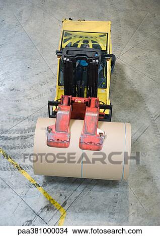 Forklift transporting roll of paper in warehouse View Large Photo Image Picture - Forklift transporting roll of paper in warehouse. Fotosearch
