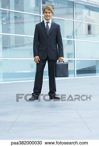 Businessman, full length portrait View Large Photo Image Stock Image - Businessman, full length portrait. Fotosearch