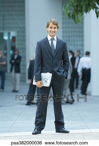 Businessman, full length portrait View Large Photo Image Stock Photograph - Businessman, full length portrait. Fotosearch