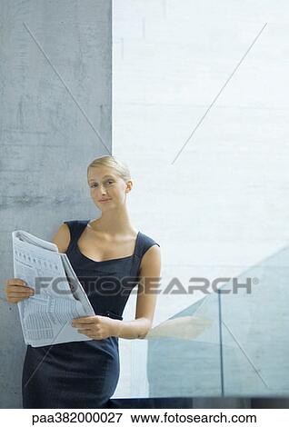Businesswoman with newspaper View Large Photo Image Stock Photo - Businesswoman with newspaper. Fotosearch
