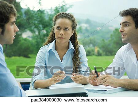 Casually dressed young executives working outdoors View Large Photo Image Stock Image - Casually dressed young executives working outdoors. Fotosearch