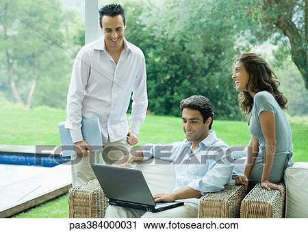 Casually dressed young executives working near edge of pool View Large Photo Image Stock Image - Casually dressed young executives working near edge of pool. Fotosearch