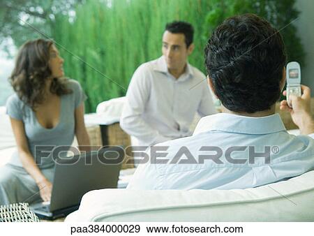 Casually dressed young executives working outdoors View Large Photo Image Stock Photo - Casually dressed young executives working outdoors. Fotosearch