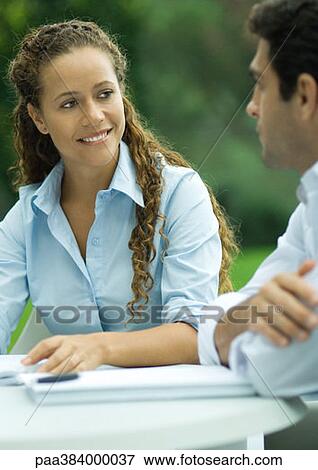 Casually dressed young executives working outdoors View Large Photo Image Stock Photo - Casually dressed young executives working outdoors. Fotosearch
