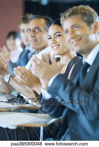 Executives sitting in seminar, clapping View Large Photo Image Stock Photo - Executives sitting in seminar, clapping. Fotosearch