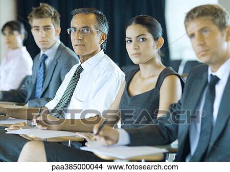 Executives sitting in seminar View Large Photo Image Picture - Executives sitting in seminar. Fotosearch