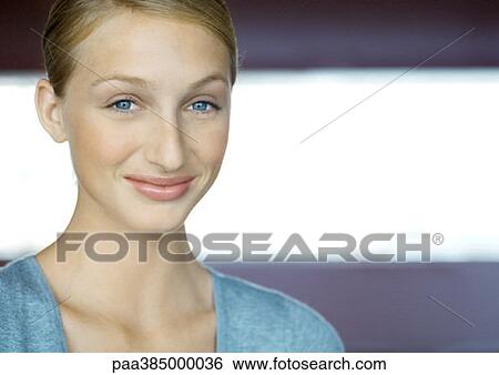 Young woman, smiling, portrait View Large Photo Image Stock Photograph - Young woman, smiling, portrait. Fotosearch