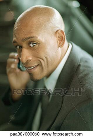 Businessman using cell phone, portrait View Large Photo Image Stock Image - Businessman using cell phone, portrait. Fotosearch