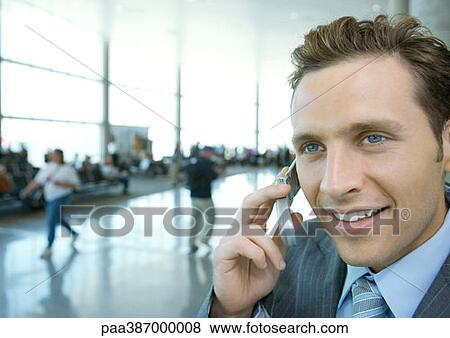 Businessman using cell phone View Large Photo Image Stock Photo - Businessman using cell phone. Fotosearch