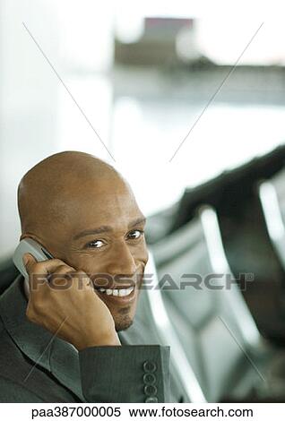 Businessman using cell phone View Large Photo Image Stock Photography - Businessman using cell phone. Fotosearch