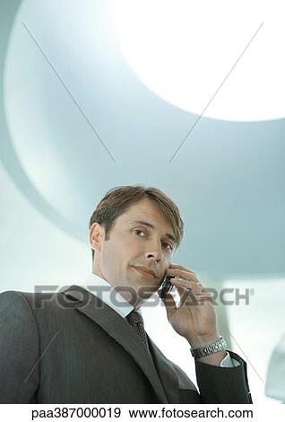 Man using cell phone View Large Photo Image Stock Photo - Man using cell phone. Fotosearch