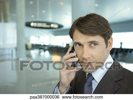 Man using cell phone View Large Photo Image Stock Photograph - Man using cell phone. Fotosearch