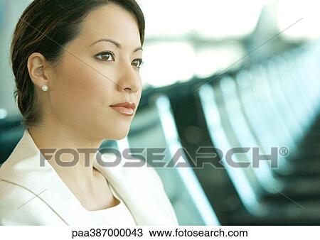 Woman sitting in airport lounge View Large Photo Image Stock Image - Woman sitting in airport lounge. Fotosearch