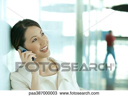 Woman using cell phone View Large Photo Image Stock Image - Woman using cell phone. Fotosearch