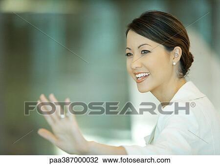 Woman waving View Large Photo Image Stock Image - Woman waving. Fotosearch
