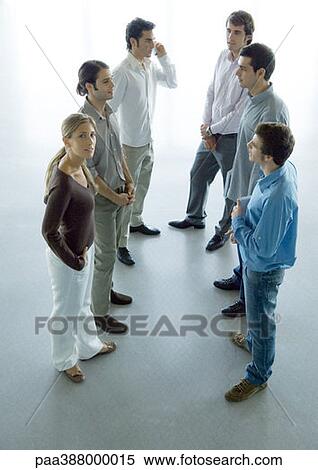 Informal business discussion among six young professionals, high angle full length view View Large Photo Image Stock Photography - Informal business discussion among six young professionals, high angle full length view. Fotosearch