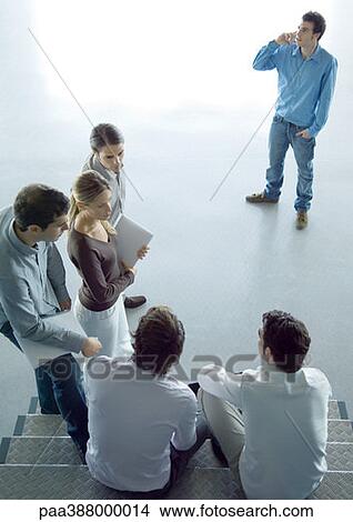 Informal business meeting, high angle view View Large Photo Image Picture - Informal business meeting, high angle view. Fotosearch