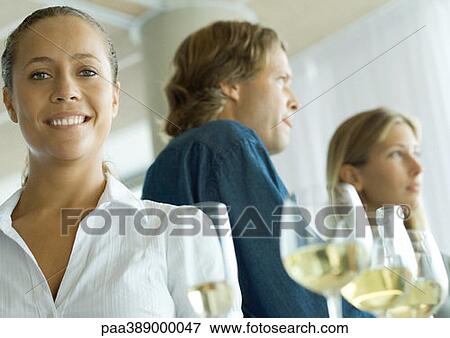 Cocktail party, woman smiling at camera View Large Photo Image Stock Photo - Cocktail party, woman smiling at camera. Fotosearch