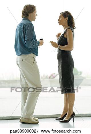 Man and woman talking during cocktail party View Large Photo Image Stock Photo - Man and woman talking during cocktail party. Fotosearch