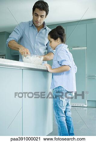Father and daughter cooking together View Large Photo Image Stock Image - Father and daughter cooking together. Fotosearch