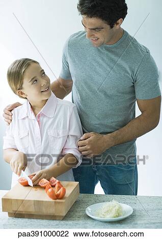 Father and daughter cooking together View Large Photo Image Stock Image - Father and daughter cooking together. Fotosearch