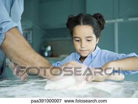 Father and daughter making dough View Large Photo Image Stock Photo - Father and daughter making dough. Fotosearch