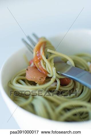 Stock Photo - Fork inside bowl of pasta. Fotosearch