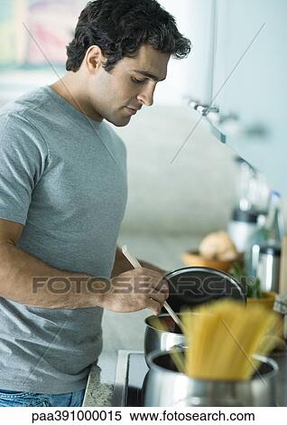 Stock Photography - Man making pasta. Fotosearch