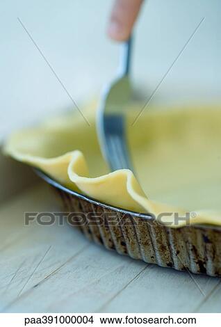 Preparing a pie crust View Large Photo Image Picture - Preparing a pie crust. Fotosearch