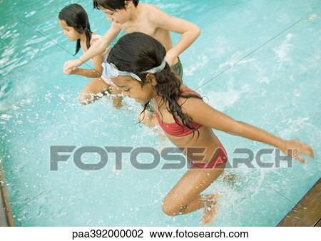Stock Image - Children in swimming pool. Fotosearch