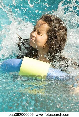 Girl in pool after jumping in, water splashing and eyes shut View Large Photo Image Stock Photograph - Girl in pool after jumping in, water splashing and eyes shut. Fotosearch