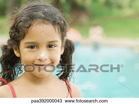 Stock Image - Girl, portrait, pool in background. Fotosearch